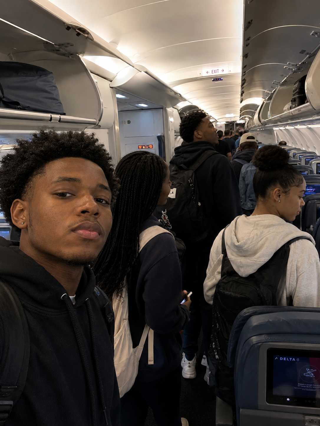 Lexbridge cohort boarding a Delta flight to the United States